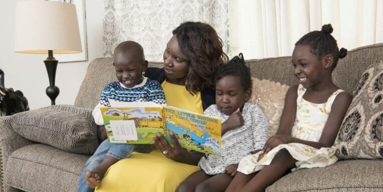 Chol Majok's family enjoys story time thanks to the Imagination Library.