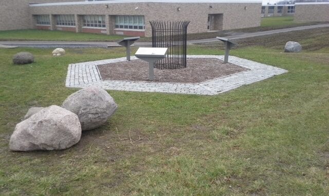 A view of the tree and plaques at the Anne Frank Garden in Cayuga County.