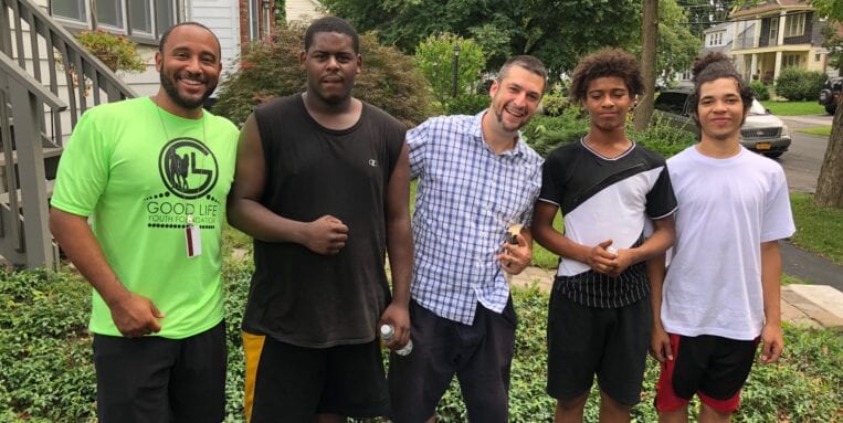 At Good Life Lawns, kids and instructors pose after a hard day's work.