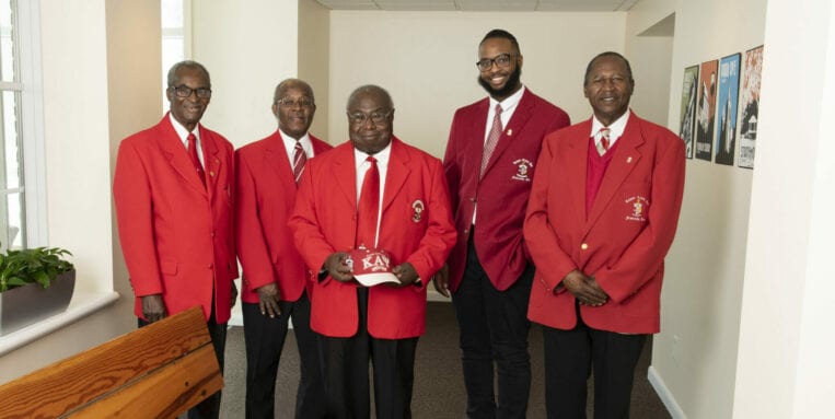 Kappa Alpha Psi Scholarship recipient and member stands with fellow members of the Kappa Alpha Psi Syracuse Alumni chapter.