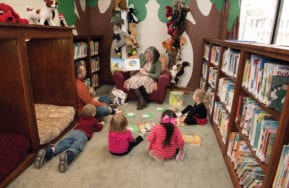 Children listen in a reading circle at Earlville Library