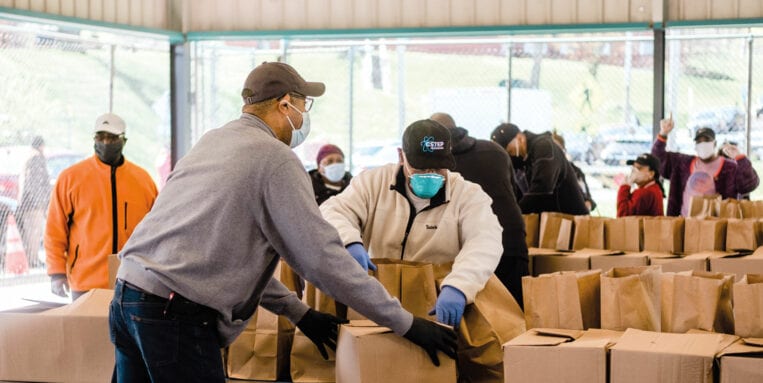 Mercy Works volunteers loading boxes for COVID relief