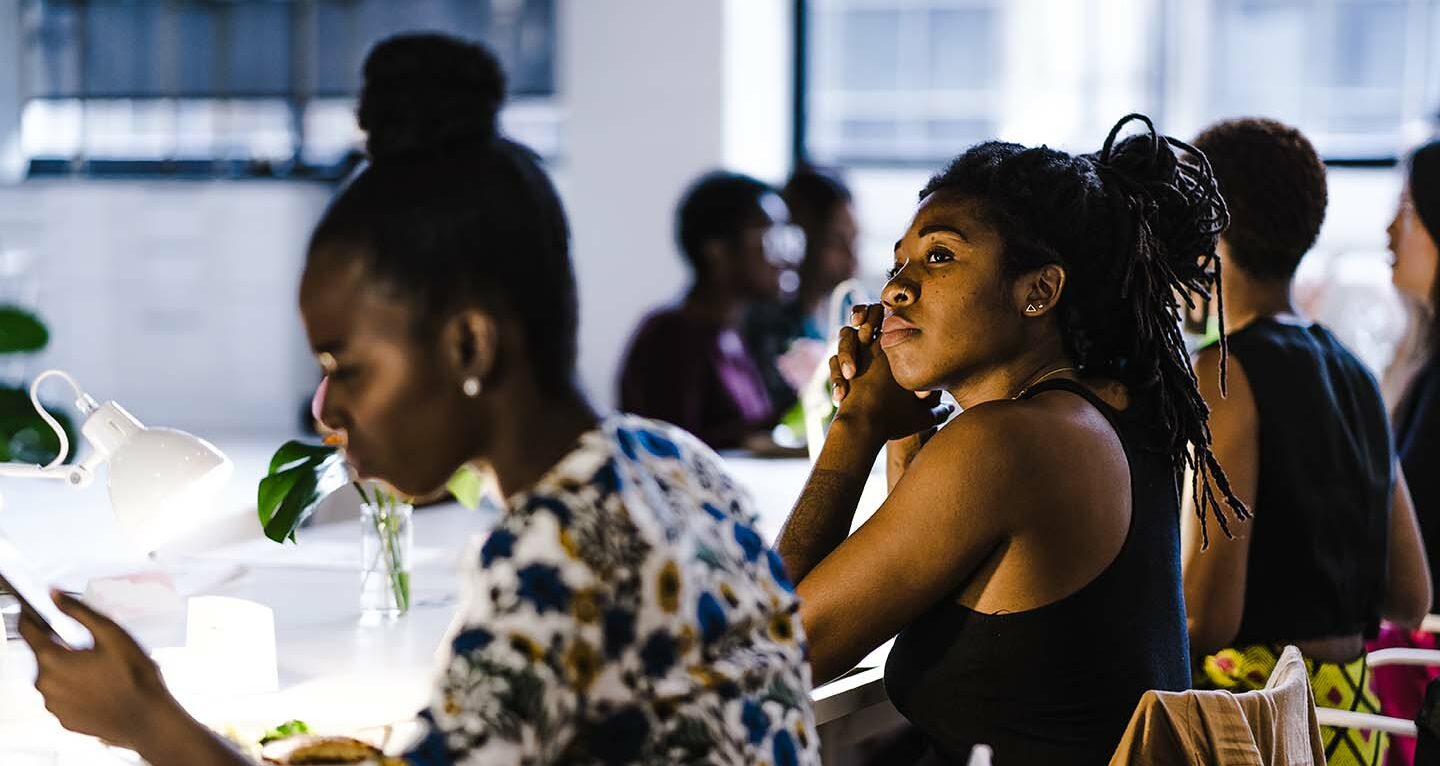 Women engaged around a table