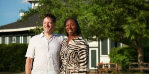 Angel Winfield and Lance Lyons stand in front of the Rev Theatre Company in Auburn