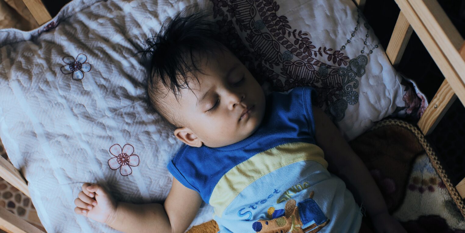 baby sleeping in a crib