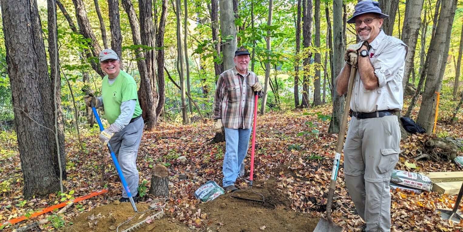 3 men standing outside